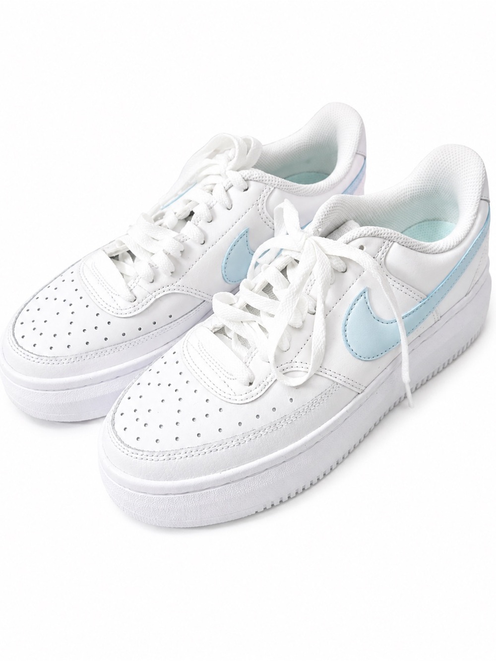 Nike White Low-Top Sneakers with Light Blue Swoosh